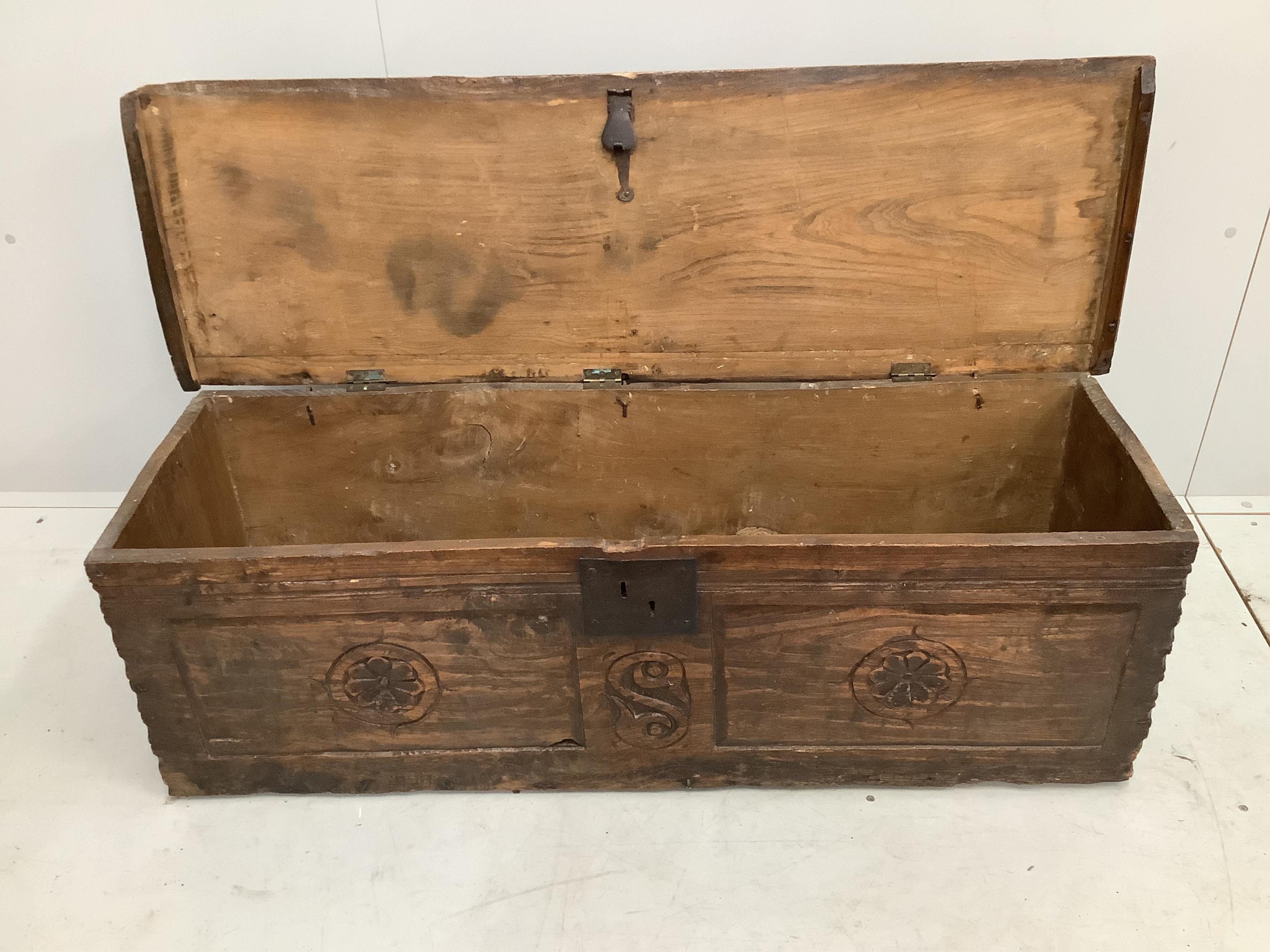 An antique elm six plank coffer, (no legs), width 122cm, depth 39cm, height 40cm. Condition - fair